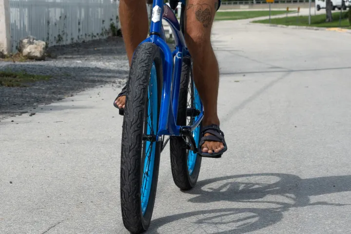 Biker riding down street