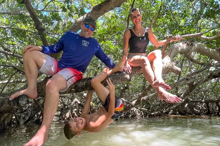 Guest playing on the mangroves during their tour